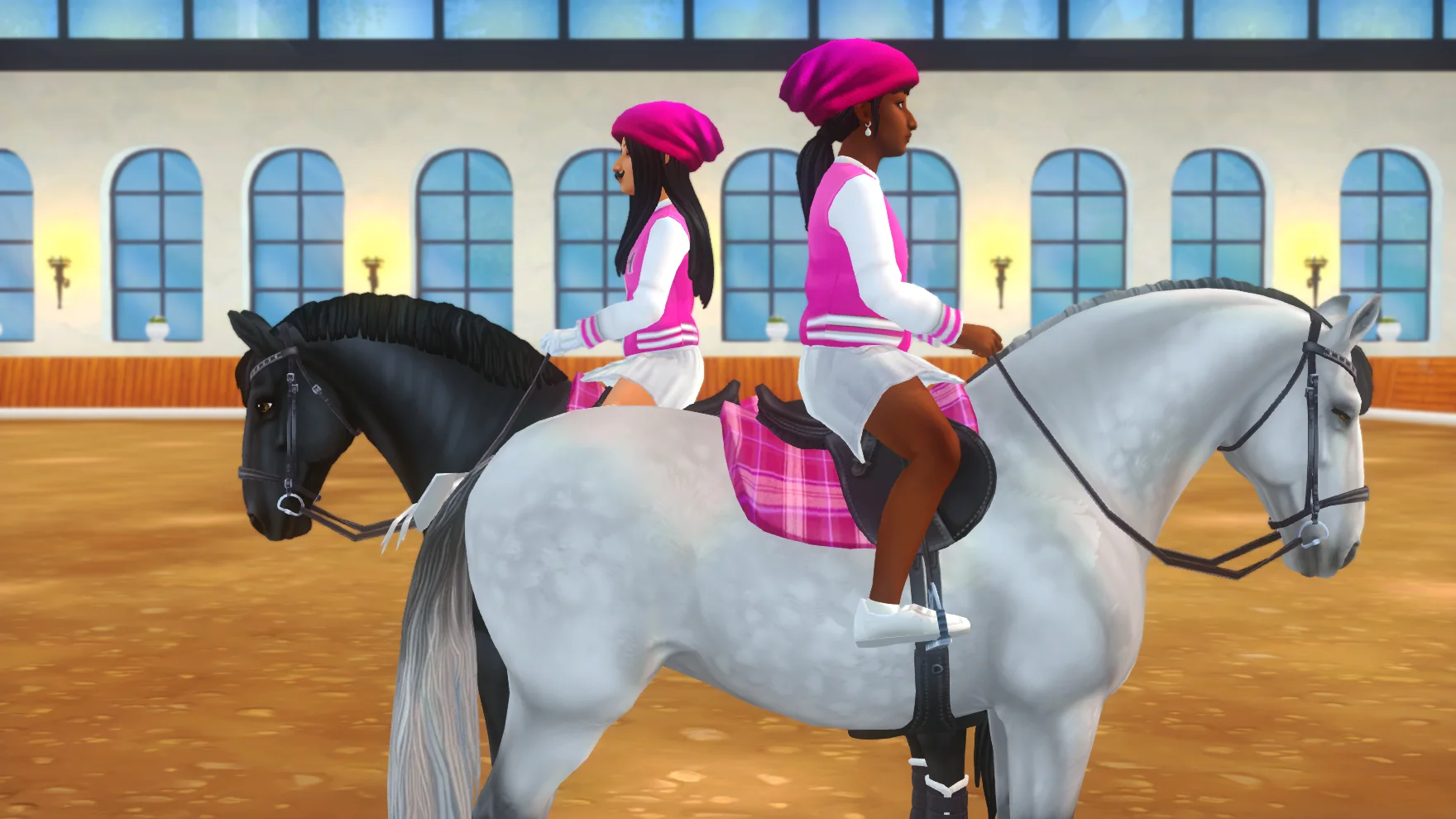 Two Pink Girls Squad riders lined up on black and white horses