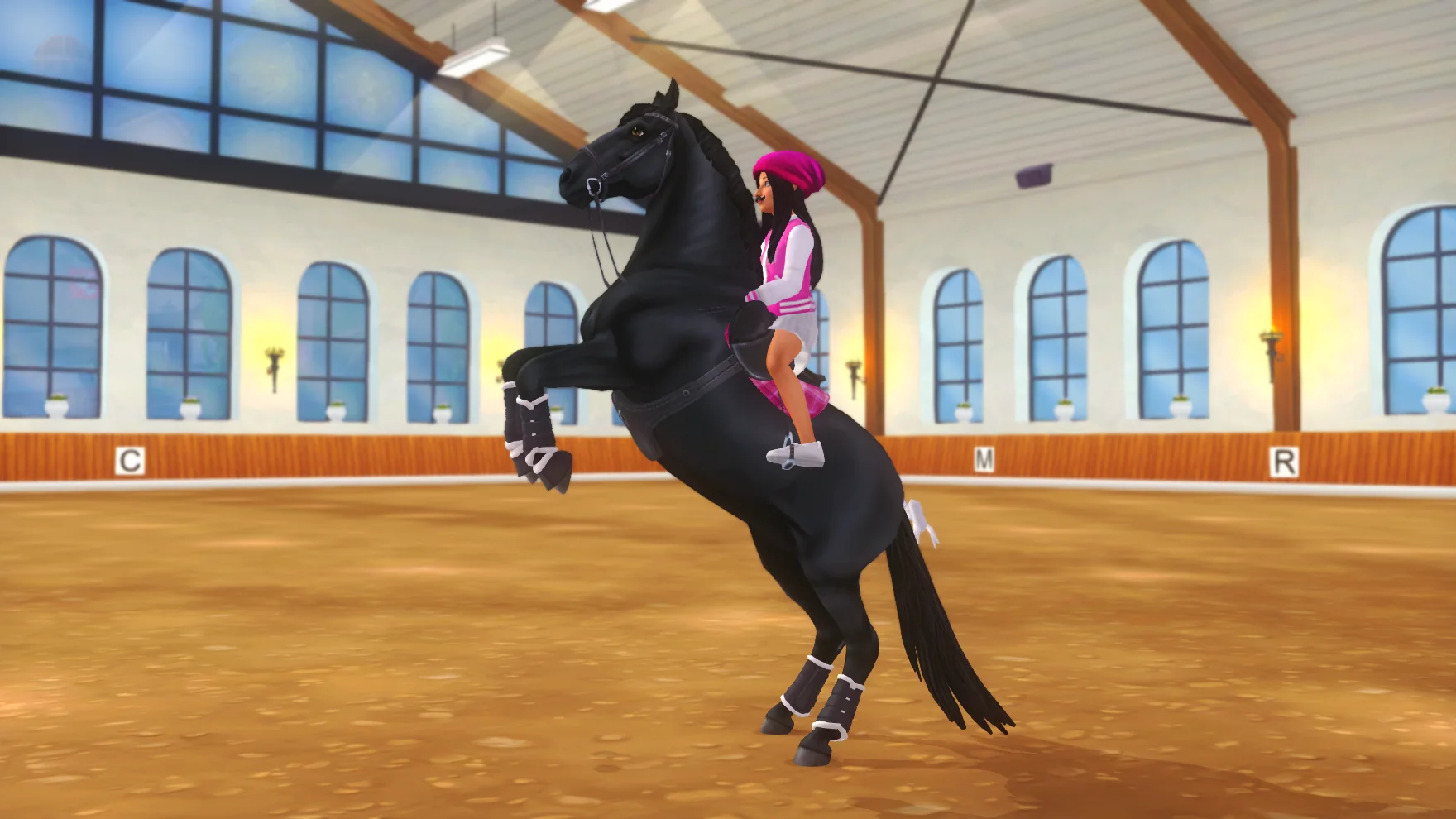 Pink Girls Squad rider performing a rear on a black horse in the arena